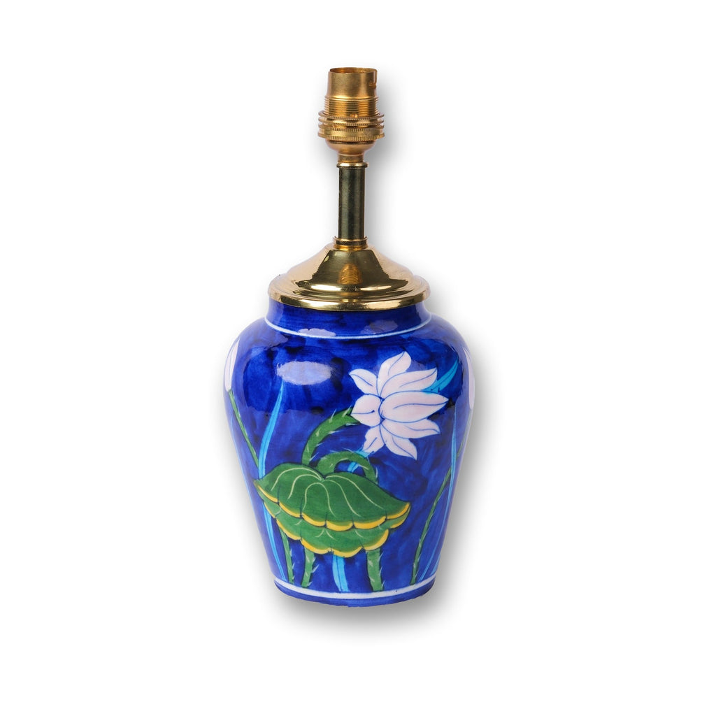 Artisan blue pottery lamp base with floral motifs for interior decoration